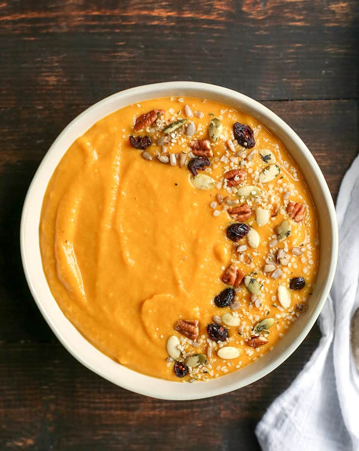 This Paleo Whole30 Squash Soup is creamy, healthy, packed with flavor, and perfect for fall! Butternut squash and pumpkin come together with apples and onions to create a savory soup with just the right amount of sweetness. It's dairy free, and gluten free.